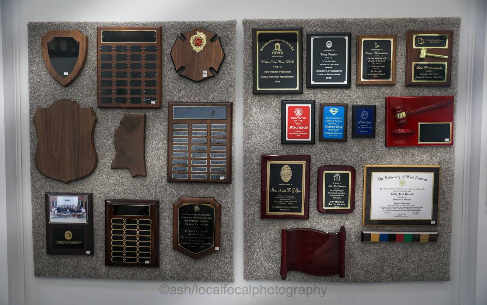 Wall of plaques including perpetual plaques, Mississippi-shaped plaques and a gavel plaque